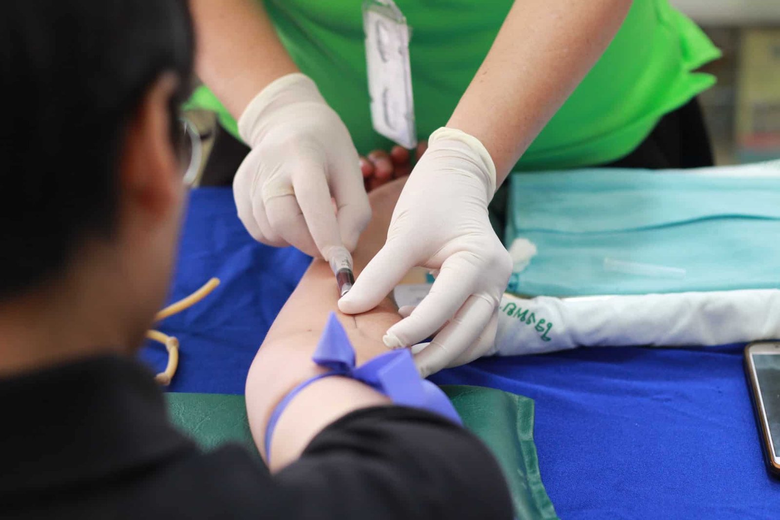 Someone getting a shot in the arm. 