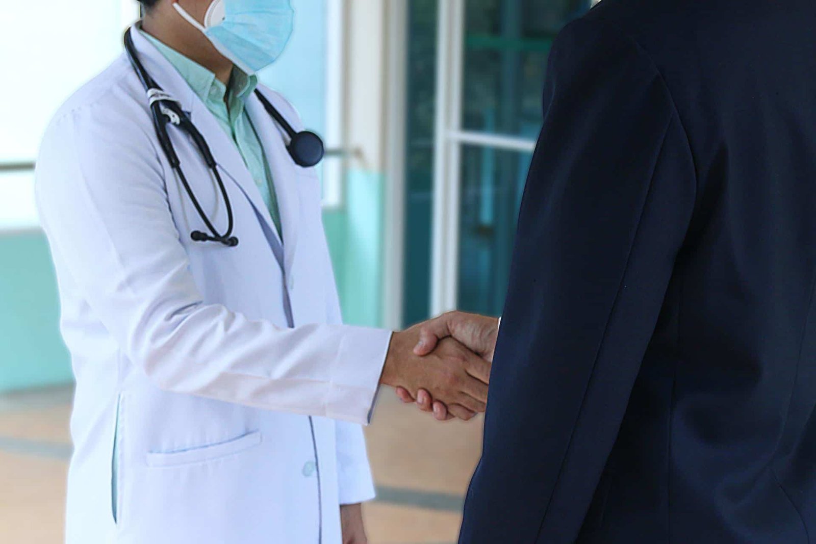 Doctor Shaking Hands with Patient